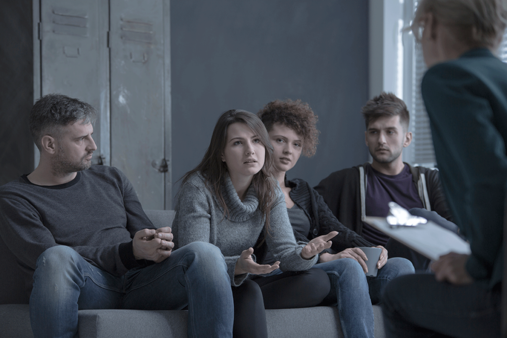 a group talks to a therapist in a residential addiction rehab center in saint petersburg